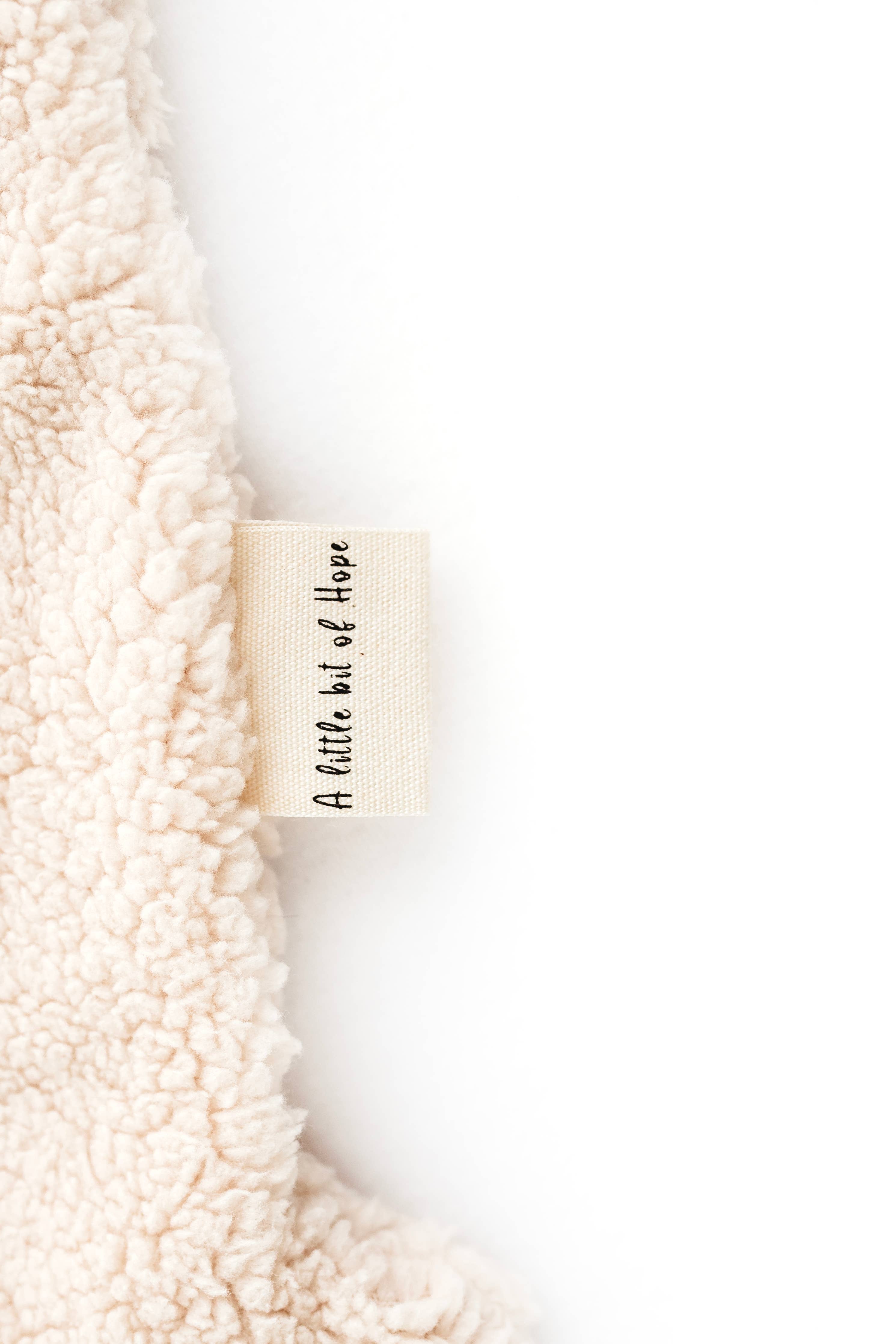 Cream sheep snuggle bear