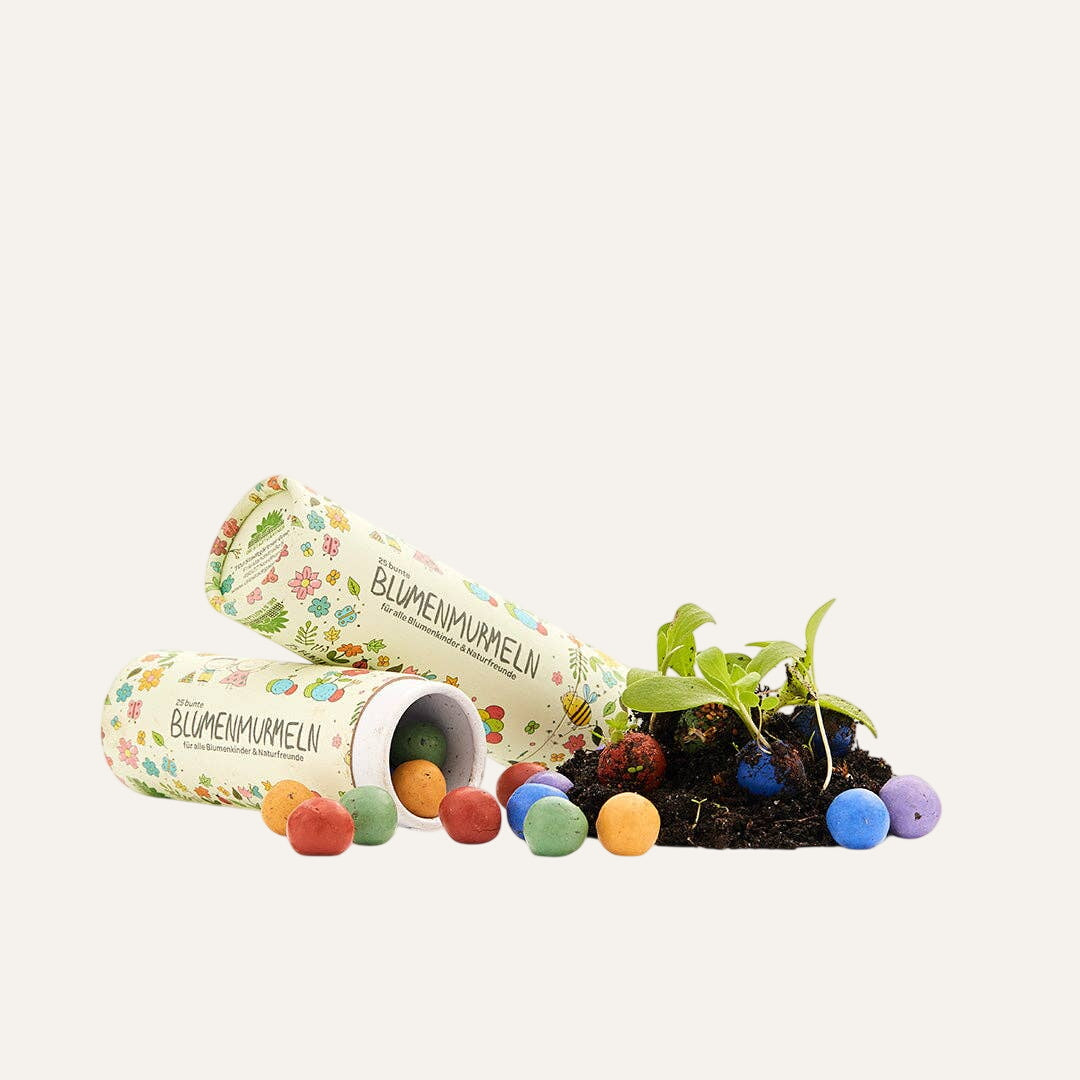 25 colorful flower marbles in a tin