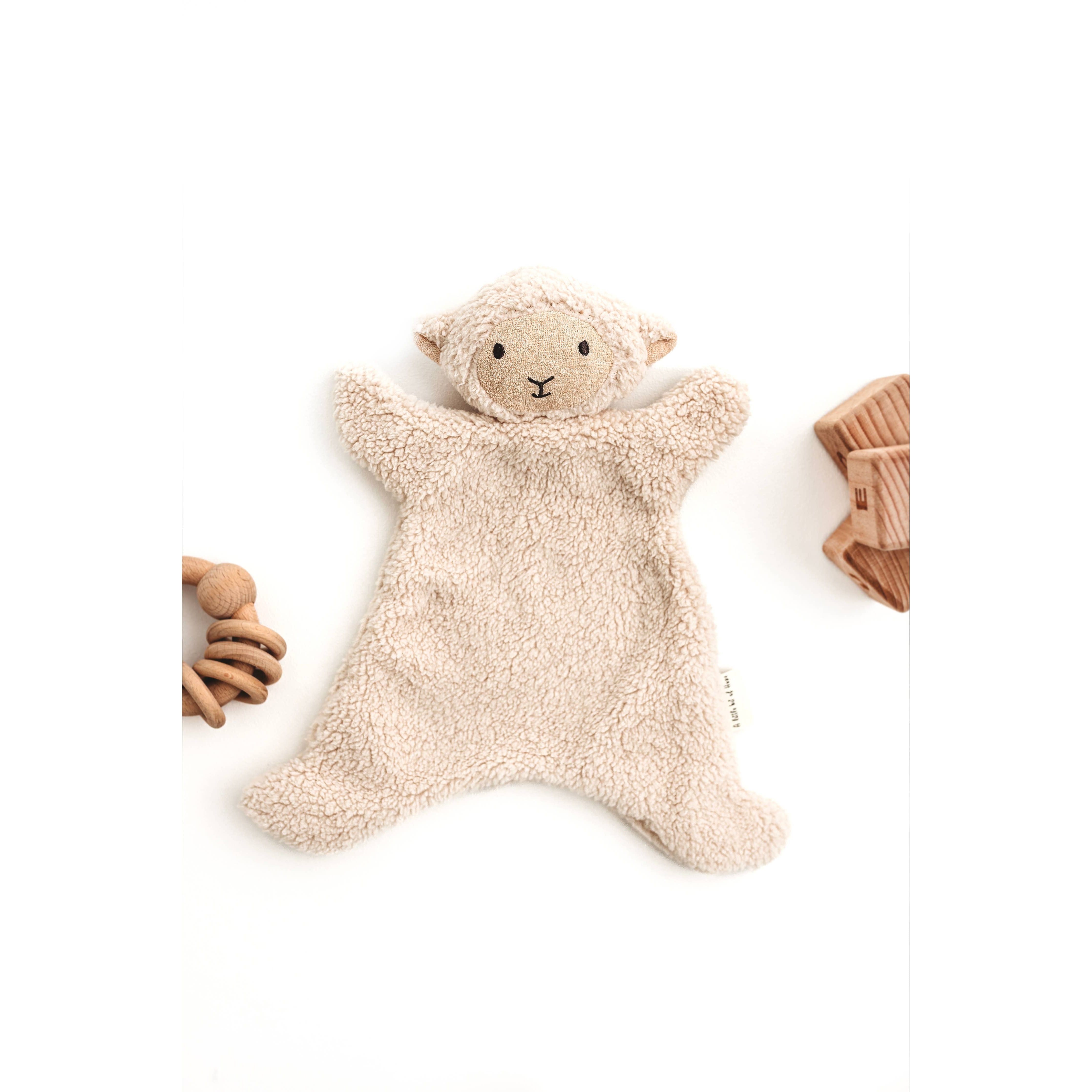 Cream sheep snuggle bear